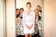 A bride and bridesmaids in their robes.