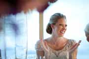 Bride laughs during her wedding reception.