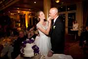 Bride feeds groom wedding cake.