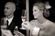 Black and white photo of bride during wedding toast.