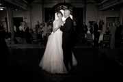 Black and white photo of a bride and groom's first dance at Beach Club wedding reception.
