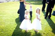 A candid moment of wedding flower girls.