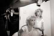 Black and white candid photo of flower girls.