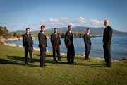 Groomsmen standing by the ocean in Pebble Beach, California.