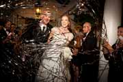Mylar confetti is shot at newlyweds departing their Beach Club wedding reception.