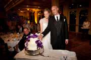 Newlyweds cut their wedding cake.