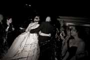 Black and white photo of newlyweds leaving their Beach Club wedding reception.