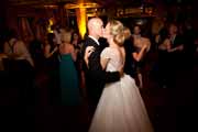 Newlyweds kiss during their Beach Club Wedding Reception.