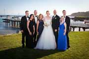 A family wedding portrait by Pebble Beach pier.