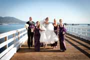 A family wedding portrait by Pebble Beach pier.