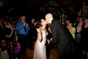Newlyweds kiss at Brazilian Room wedding reception.