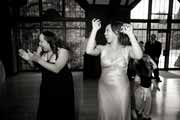 Black and white photo of bride dancing with guests at Brazilian Room wedding.
