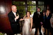 Bride feeds groom wedding cake.