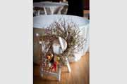 A wedding wreath rests on a chair at the Brazilian Room.