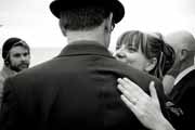 Black and white photo of bride embracing groom.