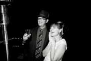 Candid black and white photo of happy newlyweds.