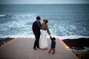 Newlyweds on a wedding platform overlooking ocean near Half Moon Bay.