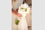 A white flower bridal bouquet bound in twine.