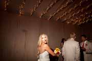 Bride gets ready to toss wedding bouquet.