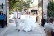 Bride and groom enter their wedding reception at Holman Ranch in Carmel Valley.