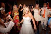 Bride dances with her friends during wedding reception.