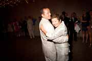 Groom and his mother embrace.