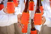 Orange and red wedding beer coozy.