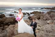 A spontaneous wedding portrait of newlyweds at Asilomar Beach in Pacific Grove, California. 