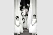 A black and white photo of a wedding party at the Lodge at Pebble Beach.