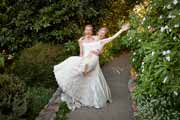 A bride picks up her bride for a candid wedding portrait.