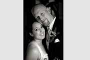A wedding day black and white portrait of a bride and groom.