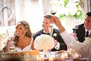 Newlyweds are toasted during their wedding reception at Holman Ranch in Carmel Valley.