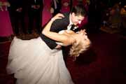 A groom dips his bride during their first dance at the Inn at Spanish Bay.