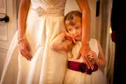 A flower girl and bride during a Pebble Beach wedding reception.