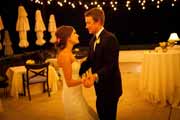 Bride and groom dance on Beach Club's patio.