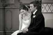 Black and white candid moment of San Carlos Cathedral wedding ceremony.