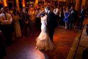 Bride and groom kiss at their Beach Club wedding reception in Pebble Beach.
