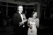 Black and white photo of groom giving toast.