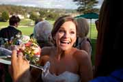 Happy bride on 18th Lawn at Lodge at Pebble Beach.