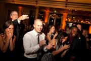 Wedding guests applaud at Beach Club in Pebble Beach.