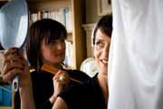 Makeup artist Maria O'Reilly does bride's hair.