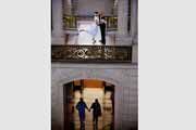 Candid photo of newlyweds kissing at San Francisco City Hall.