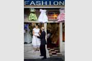Spontaneous wedding moment at Mission District fashion shop.