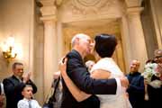 Newlyweds kiss at the conclusion of their San Francisco City Hall wedding ceremony.