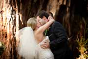 Newlyweds kiss at conclusion of their wedding ceremony.