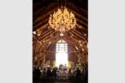 Chandelier and wedding decor in Santa Lucia Preserve barn designed by Colette Cuccia.