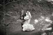 Black and white photo of father walking bride to wedding.