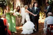 Happy bride and groom during redwood grove wedding ceremony.