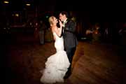 Newlyweds enjoy first dance during wedding reception.
