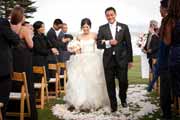 Newlyweds recess after their Pebble Beach 18th Lawn wedding ceremony.